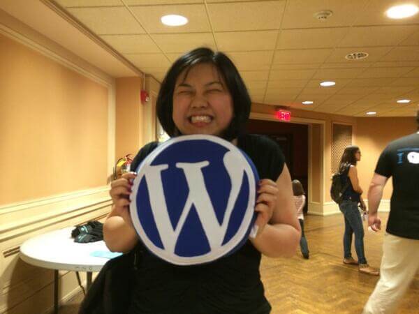Helen receiving her WordPress pillow from the folks at YIKES.
